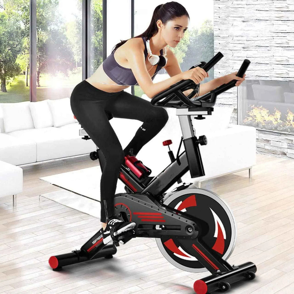 Vélo de biking silencieux avec cadre en acier, transmission par courroie silencieuse, écran LCD et support de tablette pour l'entraînement cardio en salle de sport à domicile